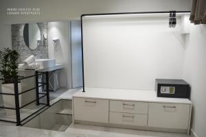 a bathroom with a sink and a mirror at Haraki Endless Blue Luxury Apartments in Haraki +26 photos
