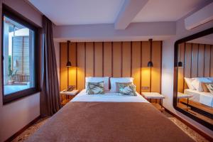 Postel nebo postele na pokoji v ubytování Arwen Hotel