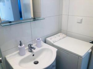 Koupelna v ubytování Apartman Nekic + 20 fotografií