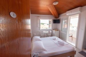Postel nebo postele na pokoji v ubytování Guest House Town Center