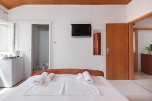 Postel nebo postele na pokoji v ubytování Guest House Town Center