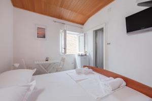 Postel nebo postele na pokoji v ubytování Guest House Town Center