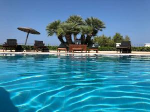 The swimming pool at or close to Villa Dolphin Akrata