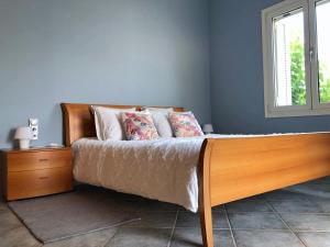 A bed or beds in a room at Villa Dolphin Akrata