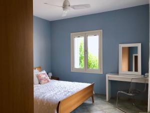 A bed or beds in a room at Villa Dolphin Akrata