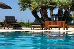 The swimming pool at or close to Villa Dolphin Akrata