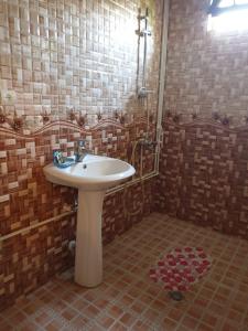 a bathroom with a sink and a shower at Tatev Shinuhayr Hotel' in Shinuhayr