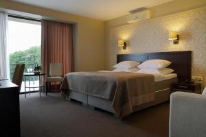 Postel nebo postele na pokoji v ubytování Margis Hotel & SPA