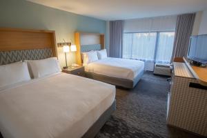 Krevet ili kreveti u jedinici u okviru objekta Holiday Inn Orlando International Airport, an IHG Hotel