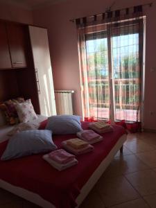 a bed with towels on it in a room with a window at Villa Mirjana in Dramalj +92 photos