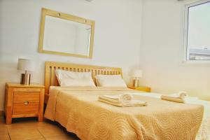 Ένα ή περισσότερα κρεβάτια σε δωμάτιο στο Tanya apartment.