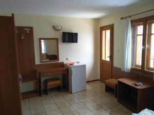 a bathroom with a sink and a mirror at Guestrooms Durna in Sozopol