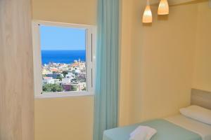 Ένα ή περισσότερα κρεβάτια σε δωμάτιο στο Aristea Apartments