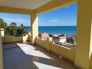 a balcony with a view of the ocean at Villa Fiorella in Sciacca