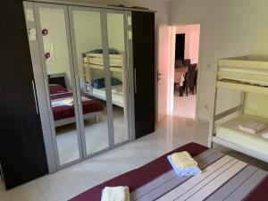 a room with a mirror and two bunk beds at Villa Mirjana in Dramalj