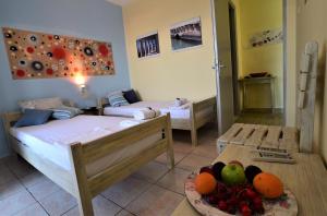 Letto o letti in una camera di Anna Koralli Studios