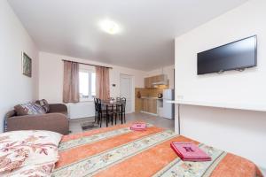 a bedroom with a bed and a living room at Panorama in Vapnyarka
