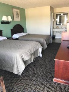 a hotel room with two beds in a room at Lakeside inn in Eufaula