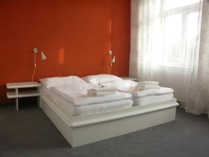 Postelja oz. postelje v sobi nastanitve Hotel Saloon