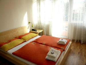 Postelja oz. postelje v sobi nastanitve Hotel Saloon