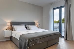 Posteľ alebo postele v izbe v ubytovaní Villa Lobe + 37 fotografií