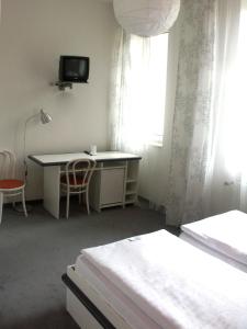 Postelja oz. postelje v sobi nastanitve Hotel Saloon