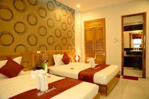 Letto o letti in una camera di Red Diamond Hotel