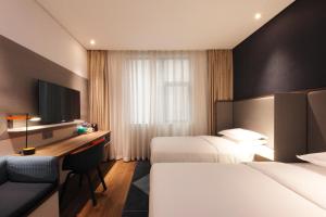 Postel nebo postele na pokoji v ubytování Holiday Inn Express Hefei Shushan by IHG