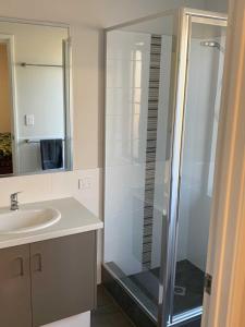 a bathroom with a shower and a sink at Manjimup Gateway Hotel in Manjimup