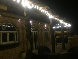 a group of lights on a house at night at Al-Madina Tower Apartments in Marsa Matruh