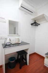 Kuchyň nebo kuchyňský kout v ubytování Rose Cottage Hotel Taman Johor Jaya