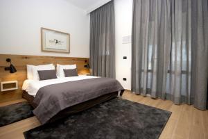 Ein Bett oder Betten in einem Zimmer der Unterkunft Rooms Alla Beccaccia