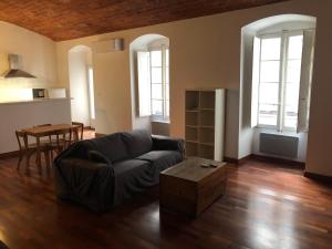 a living room with a couch and a table at Boulevard GRAZIANI in Bastia