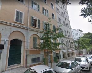 a building with cars parked in front of it at Boulevard GRAZIANI in Bastia