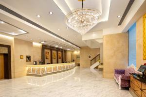 a lobby of a hotel with a chandelier at Ramada Hong Kong Grand View in Hong Kong