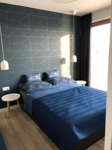 Posteľ alebo postele v izbe v ubytovaní Apartament Komfortowy z klimatyzacja Plazowa 6