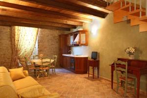 a living room with a couch and a table at Residence Borgo Da Mare in Monteprandone