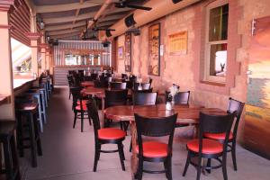 a row of tables and chairs in a restaurant at The Silverton Hotel in Silverton