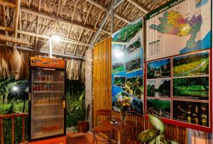 a restaurant with a map on the wall and a table at Bai Dinh Eco Homestay in Ninh Binh