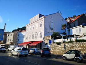 a group of cars parked on the side of a street at Main Bus Station Rooms in Dubrovnik
