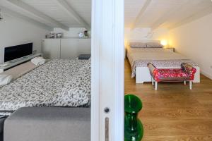 A bed or beds in a room at Casetta Gattini