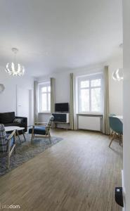 Posedenie v ubytovaní Stylowy 2-pokojowy apartament 5 min. od Rynku