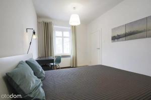 Posteľ alebo postele v izbe v ubytovaní Stylowy 2-pokojowy apartament 5 min. od Rynku