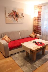 a living room with a couch and a coffee table at Pati Ferien Apartmens in Łukęcin +65 photos
