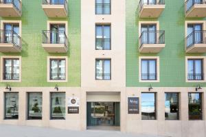 a facade of a building with windows at Acta The Avenue in Porto