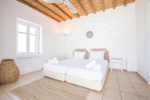 Postel nebo postele na pokoji v ubytování Villa Phoebe + 25 fotografií