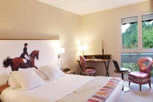 Postelja oz. postelje v sobi nastanitve Best Western Plus Hotel Du Parc Chantilly