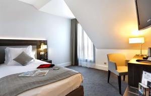 Postelja oz. postelje v sobi nastanitve Best Western Plus Hotel Du Parc Chantilly