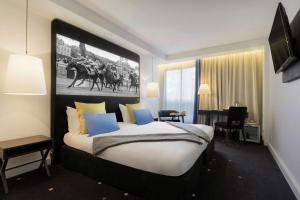 Postelja oz. postelje v sobi nastanitve Best Western Plus Hotel Du Parc Chantilly