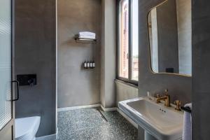 a bathroom with a sink and a mirror at Chapter Roma in Rome